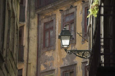 Low angle view of lamp on building