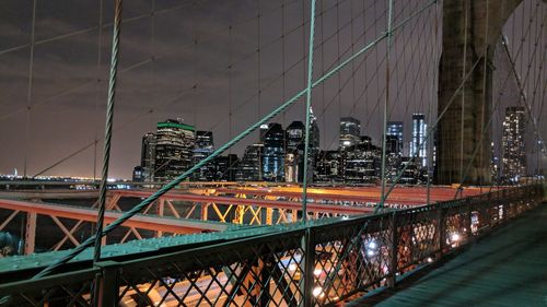 Bridge in city at night