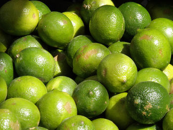 Ripe limes at a farm stand.