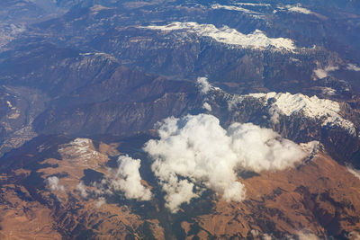 High angle view of snowcapped mountains against sky