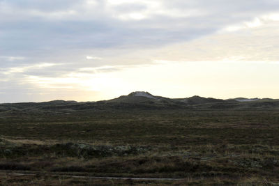 Scenic view of landscape against sky during sunset