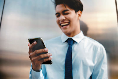 Young man using mobile phone