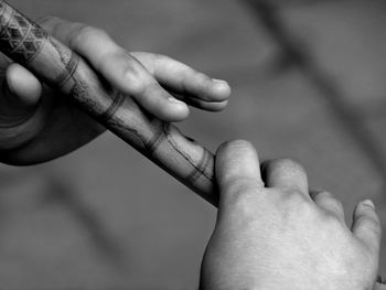 Close-up of man holding hands