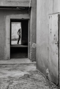 Man standing in abandoned building