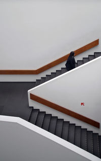 High angle view of man on staircase