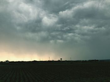 Scenic view of field against sky during sunset