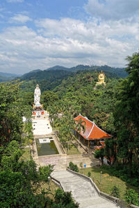 View of temple building against cloudy sky