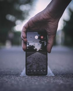 Close-up of person holding mobile phone