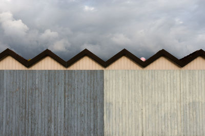Houses in barn against sky