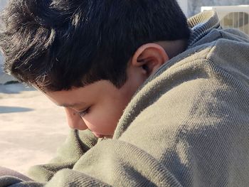 Close-up portrait of boy in winter