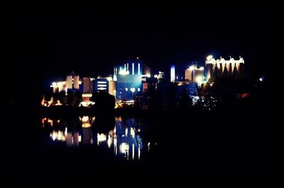 Reflection of illuminated buildings in water