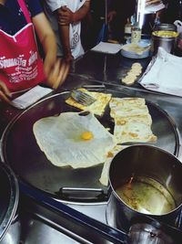 Close-up of person preparing food in kitchen