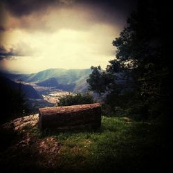 Scenic view of mountains against cloudy sky