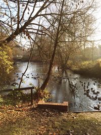 Scenic view of lake against sky at sunset