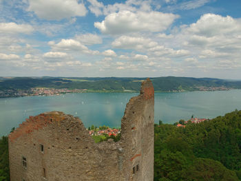 Panoramic view of sea and buildings against sky