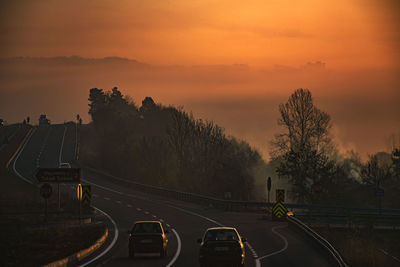 High angle view of highway against sky during sunset