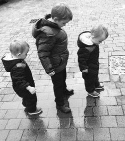 Boys playing with umbrella