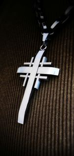 High angle view of cross on table