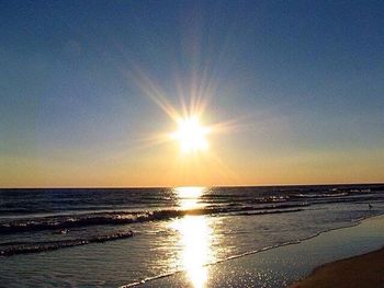 Scenic view of sea against sky at sunset