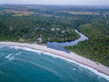 High angle view of sea and city