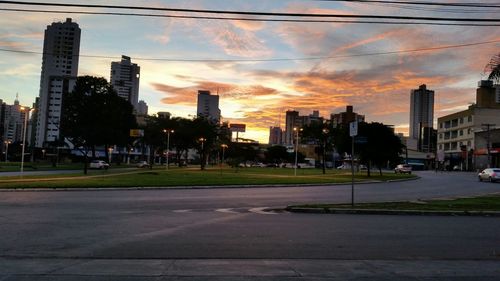 Buildings in city at sunset