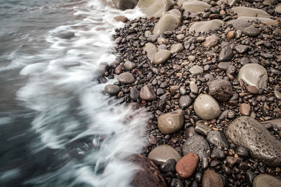 High angle view of stones on beach