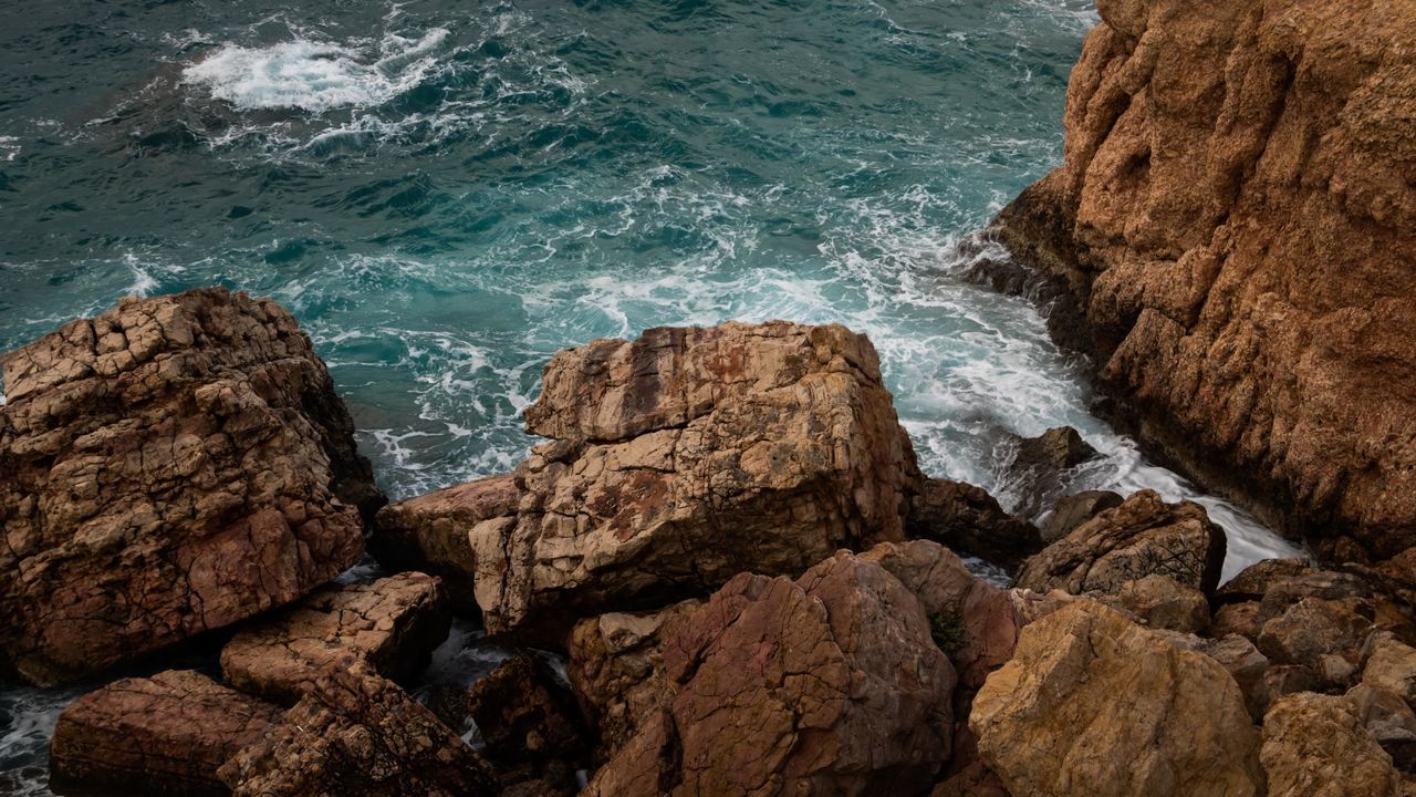rock, sea, water, coast, ocean, shore, land, beach, beauty in nature, nature, cliff, terrain, wave, rock formation, no people, motion, scenics - nature, geology, body of water, day, high angle view, outdoors, sports, horizon, tranquility