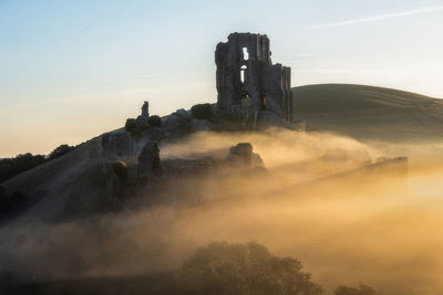 Panoramic view of castle against sky during sunset