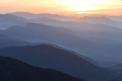 Scenic view of mountains against sky during sunset