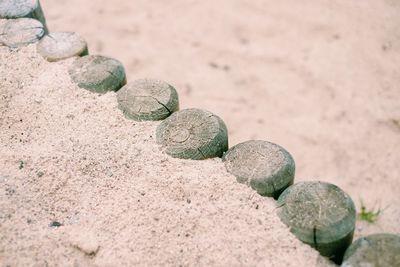 Close-up of pebbles on sand