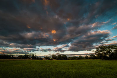 Scenic view of dramatic landscape against cloudy sky