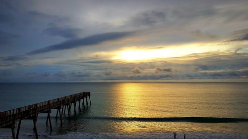 Scenic view of sea against sky at sunset