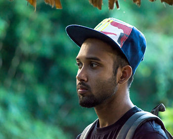 Close-up of thoughtful man in cap