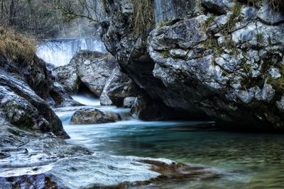 Scenic view of river flowing through rocks