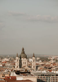 View of buildings in city against sky