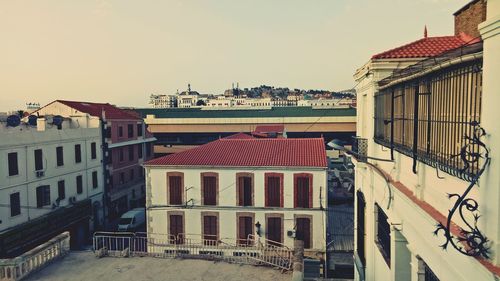 Houses against clear sky in city