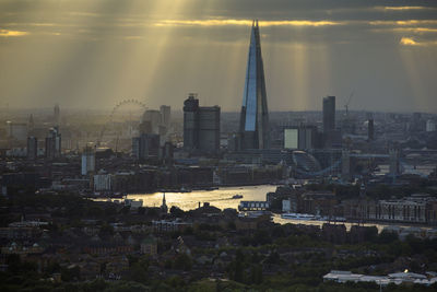 Buildings in city at sunset