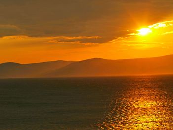 Scenic view of mountains at sunset