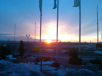 Scenic view of snow covered landscape at sunset