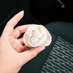 Close-up of hand holding ice cream cone