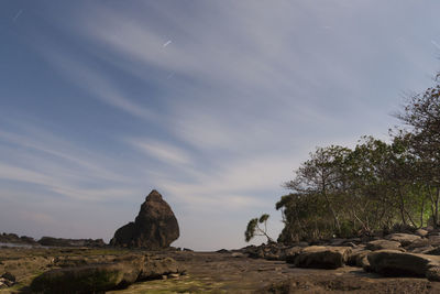 Rock formations on landscape against sky