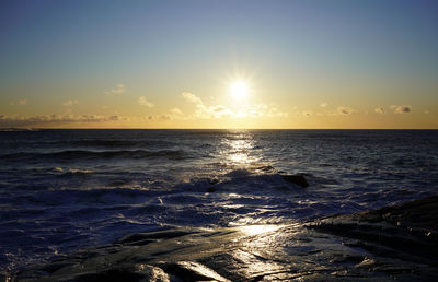 Scenic view of sea against sky at sunset