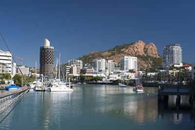 View down the quay of boats moored in the calm water of townsville marina in queensland, australia