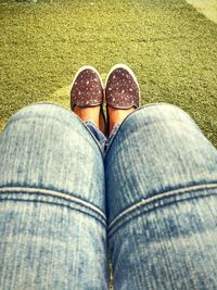 Low section of woman on grass