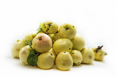 Close-up of grapes over white background