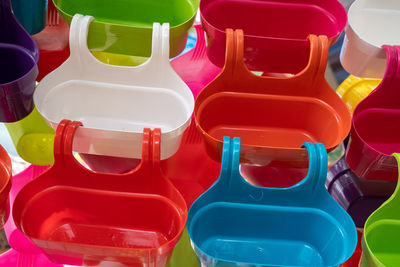 Full frame shot of multi colored plastic container outdoors