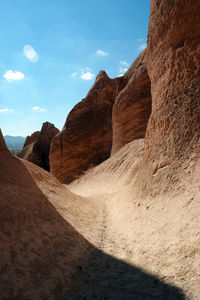 Rock formations in desert against sky