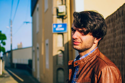 Portrait of smiling young man outdoors