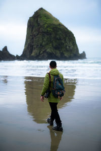 Full length rear view of man on beach