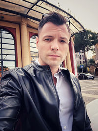 Portrait of young man standing outdoors